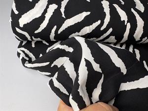 Fastvævet viscose - zebra i sort og offwhite