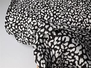 Fastvævet viscose - leopard pletter i sort og offwhite