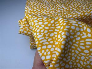 Bomuldsjersey - sommergul med små hvide pletter