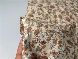 Vævet bomuldspoplin - romantiske blomster på lys bund