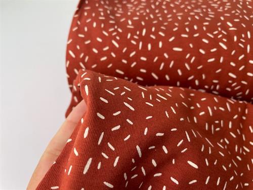 Bomuldsjersey - terracotta med offwhite mønster 
