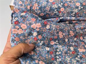 Bomuldsjersey - yndige blomster på blå bund