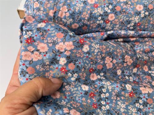 Bomuldsjersey - yndige blomster på blå bund