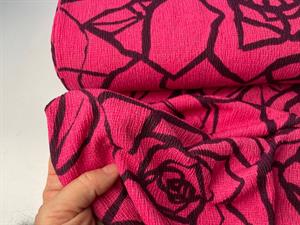 Creppet polyester - pink med stiliseret rose mønster