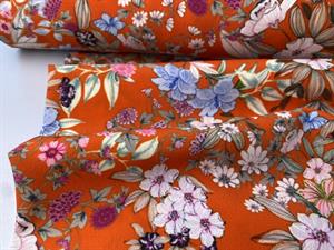 Fastvævet - lækker orange med flotte blomster