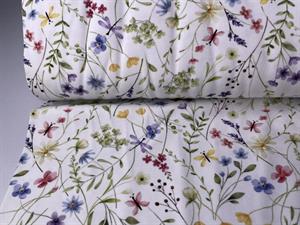 Bomuldsjersey - små pastelfarvede blomster på hvid bund