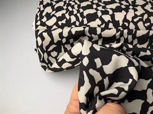 Fastvævet polyester - grafisk mønster, lidt fleksibel