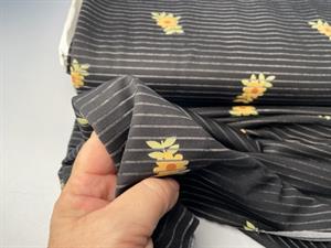 Jersey - diskrete blomster på sort bund med transparent stribe