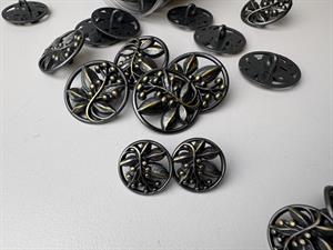 Fransk knap - sort/guld i filigran bladmønster 