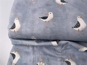 Bomuldsjersey - fine måger på lys denimblå bund