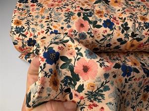 Bomuldsjersey - skønne blomster på pudder bund