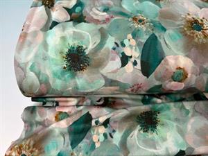 Viscosejersey - store smukke blomster i aquamarin